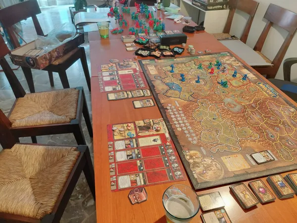The World of Warcraft board game set up mid-game with miniatures, player boards and card decks